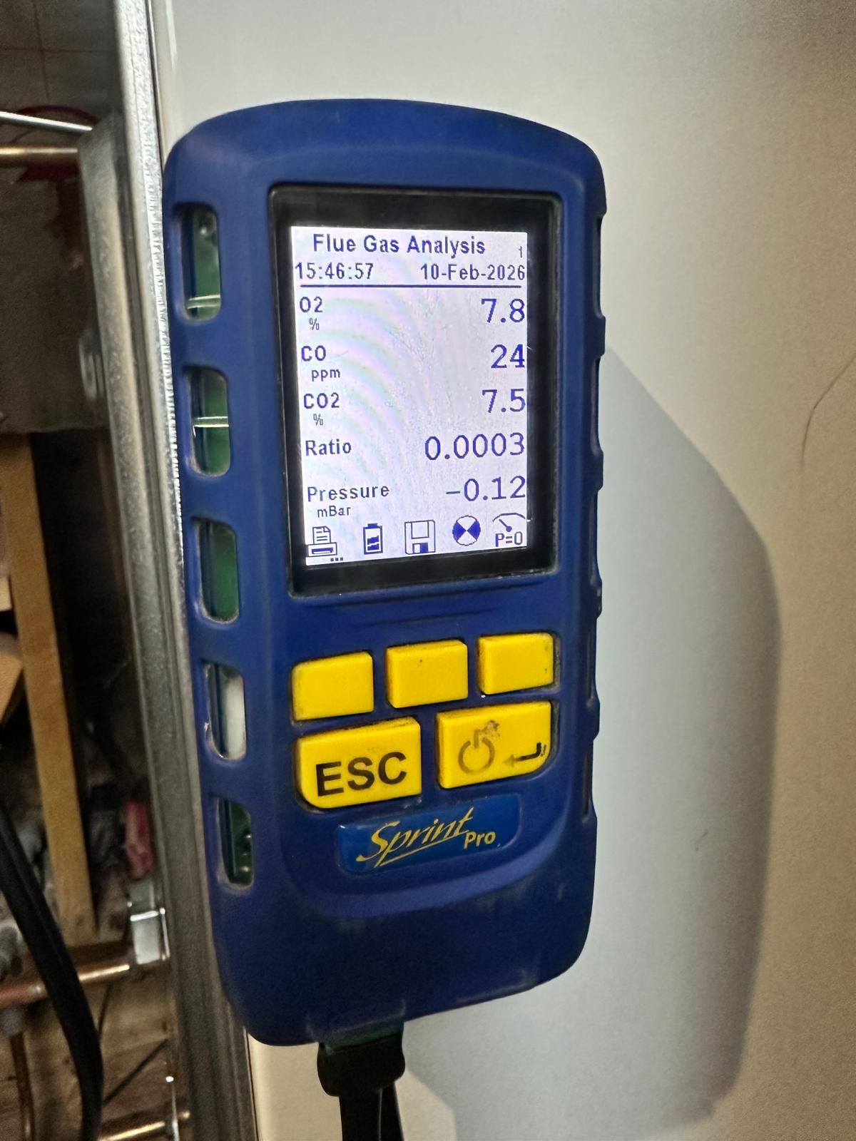 Kane Sprint Pro flue gas analyser showing O2, CO and CO2 combustion readings during a boiler service