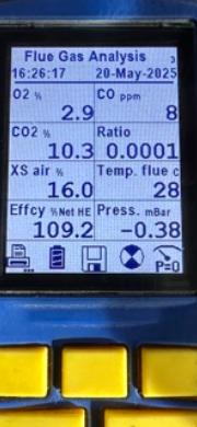Flue gas analyser display showing 109.2% net efficiency after a boiler service